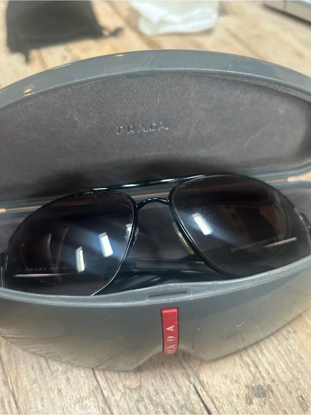 Prada Black Frame Brown Lens Aviator Sunglasses